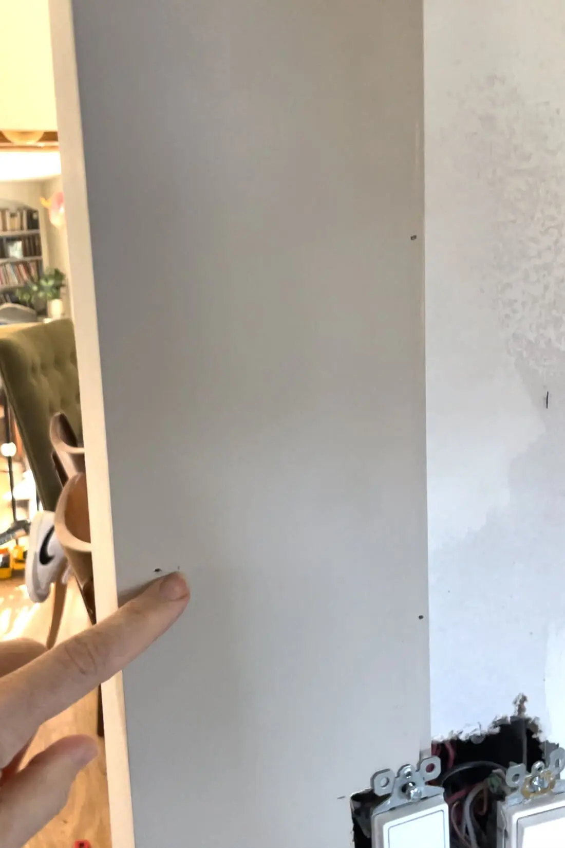 Installing a shiplap backsplash.